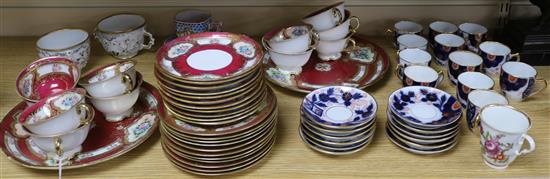 A Bohemian crimson ground tea set and an Imari pattern part coffee set, two chocolate cups and a faience cup and saucer